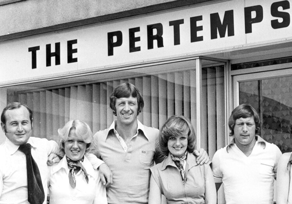 Constance’s son, Tim Watts, joins the business opening a second office in Wolverhampton. Here he and the team are pictured smiling outside the office 